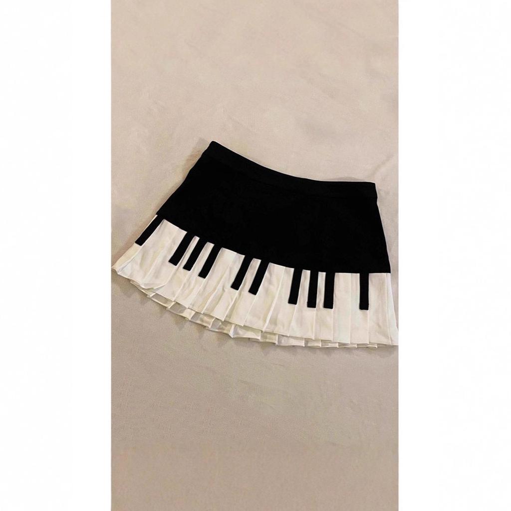 Completo retrò bianco e nero design pianoforte artistico gonna corta primavera estate autunno nuova gonna a pieghe piccole