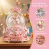 Snow globe music box with colored LED lights, merry-go-round, crystal ball, and automatic snowfall. Popular as a birthday or Christmas gift for girls,