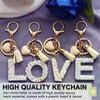 26 Initialen Alphabet A bis Z Schlüsselanhänger Beige Herzförmige Quaste Schlüsselanhänger Mode Tasche Hängendes Ornament Auto Anhänger Geschenke
