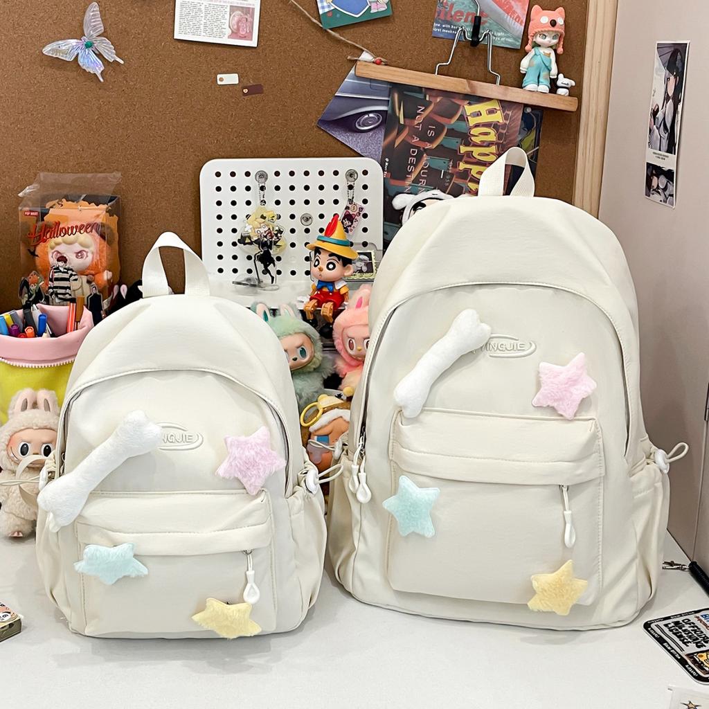 Solid color simple casual backpack female niche design sense lightweight size backpack class primary and secondary school students schoolbag