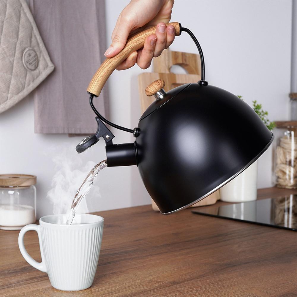 Black Steel Kettle with Whistle for Boiling Water on the Stove