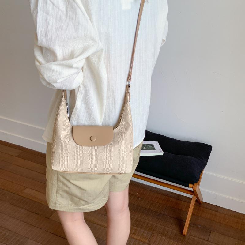 Lässige Tasche Damen Sommer neue Mode Nischendesign Umhängetasche tragbare Knödeltasche