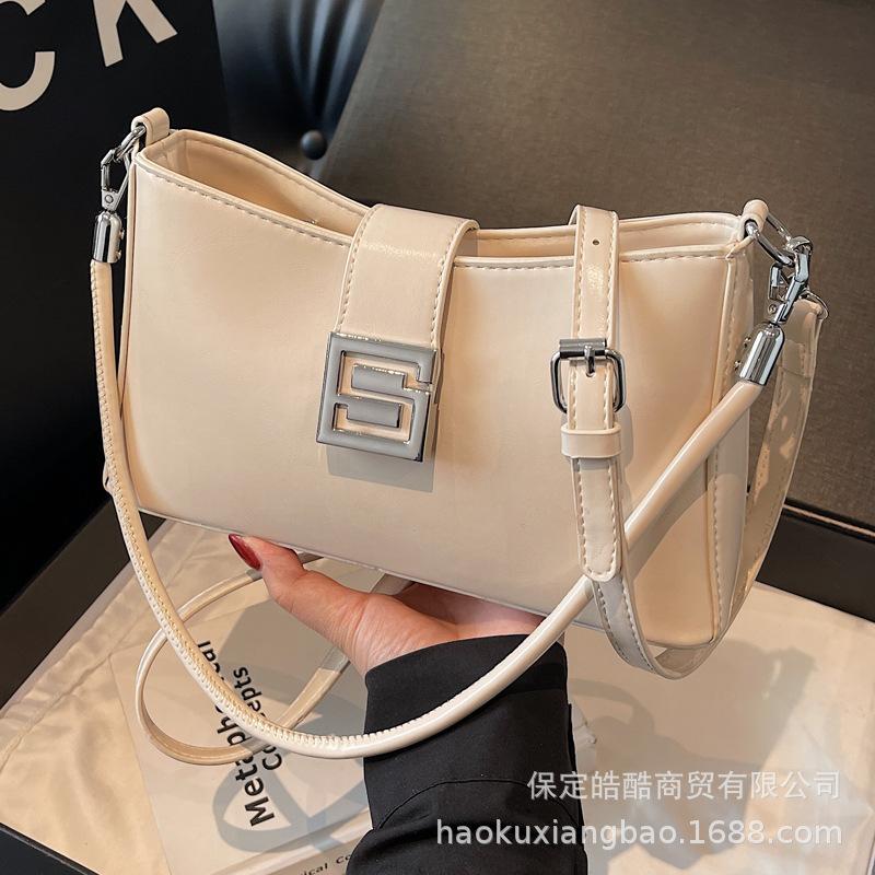 Korean version of versatile bag women's 2025 spring and summer retro fashion baguette bag niche high-end commuter casual messenger bag