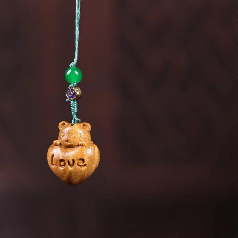 Twelve Zodiac Animal Charms Green Sandalwood Set: Rat, Ox, Tiger, Rabbit, Dragon, Snake, Horse, Sheep, Monkey, Rooster, Dog, Pig.