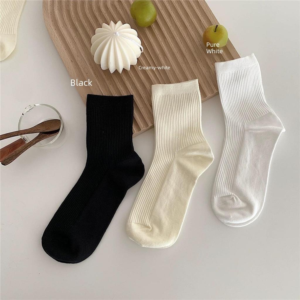 "Women's Mid-Tube Solid White Socks - Trendy Japanese Style for Autumn and Winter"