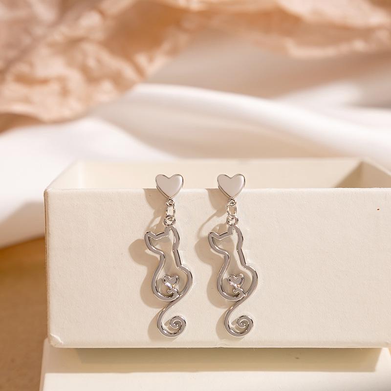

Silver Needle Cute Cat Earrings: Simple Japanese & Korean Design, Hollow Animal Style, Sweet & Gentle for Women.