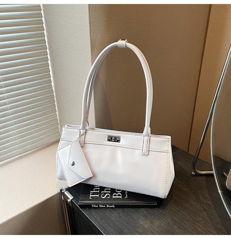 

Retro fashion versatile hand carry platinum bag women 2025 summer new light luxury large capacity shoulder commuter bag tide фіолетовий
