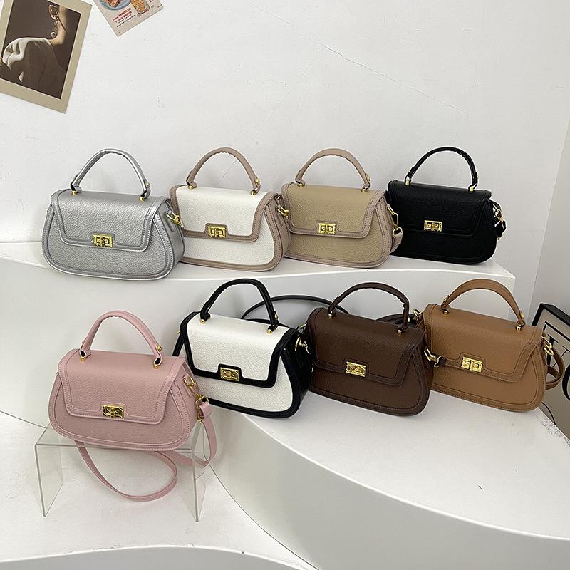 Spring niche design fashionable contrasting color saddle bag portable shoulder crossbody trendy women's bag