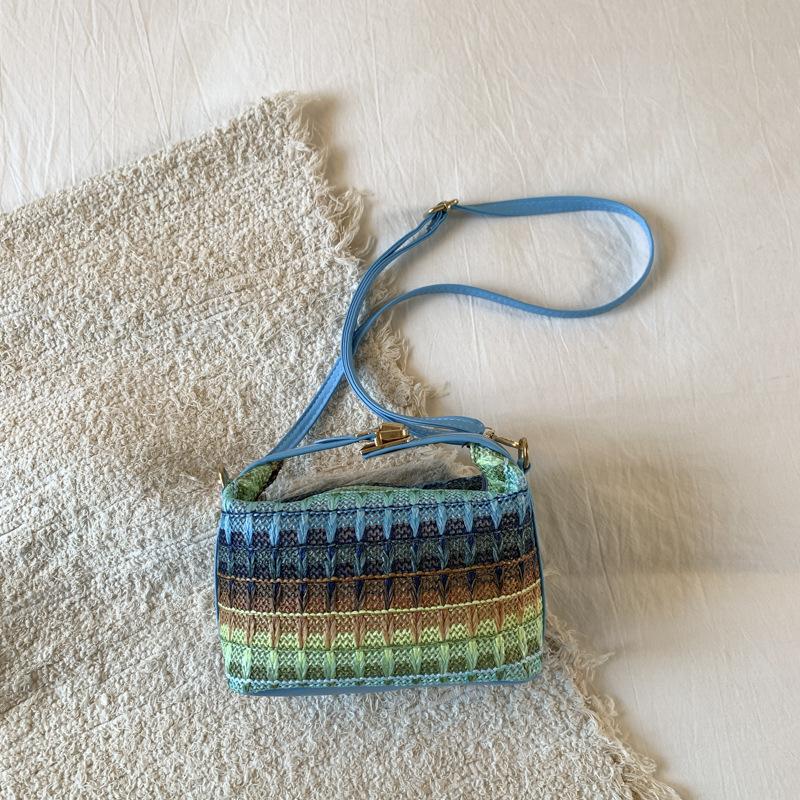 

Spring and summer new rainbow multi-colored grass woven small bag casual women s bag portable shoulder messenger bag светло-синий
