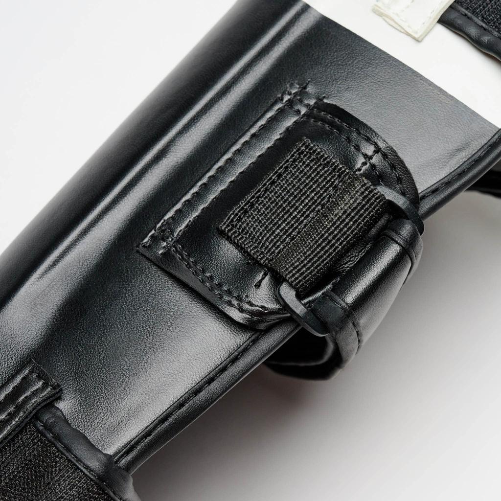 LEONE 1947 Bojové sporty Kickbox MMA Chránič holení Chránič holení EVA Materiál Polstrování Velikost PT111 [SHOCK] S/Černá [Originální]