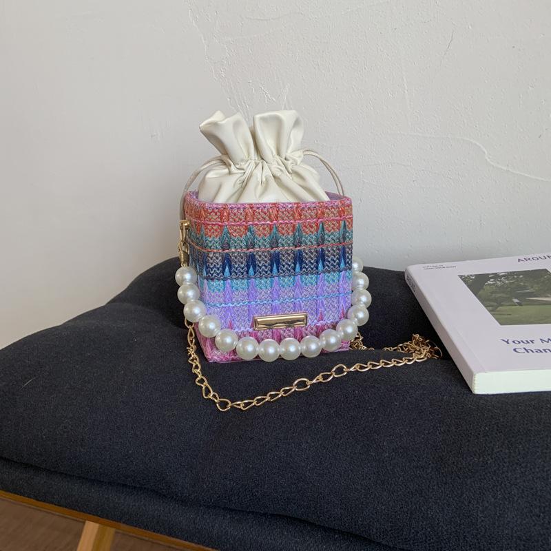 

Striped portable small bag women s 2025 new summer small fresh messenger bag foreign style hand carry chain bucket bag фиолетовый