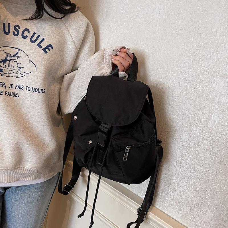 Large-capacity student party early spring new leisure niche design handbag commuting versatile canvas backpack