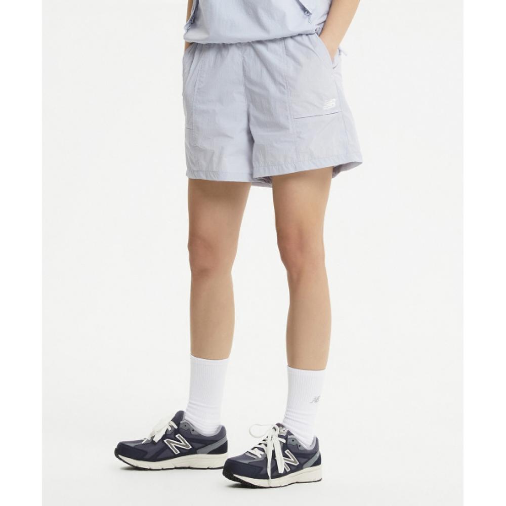 

NEW BALANCE NBNVE2W422 ЖЕНСКИЕ Легкие короткие тканые брюки из 4 частей L СИНИЕ