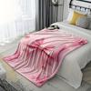 A Cozy Pink Flannel Blanket with a Bow Pattern - Soft and Warm, Perfect for Camping, Lounging On the Sofa, Bed, or Chair; a Grea