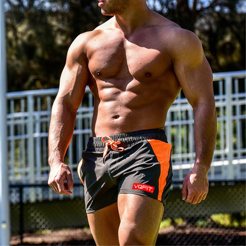 Muscleguys Summer Gyms Shorts Men Bermuda Beach Hot Cargo Simple Patchwork Solid Men Board Shorts Male Brand Fitness Mens Shorts