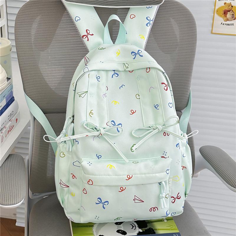 Cute Bow Tie Print School Backpack Lightweight Nylon Zipper Daypack with Front Pocket for Teen Girls Daily Travel