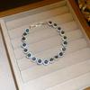 Bracciale Geometrico in Zirconi di Lusso Raffinato: Design Colorato e Versatile