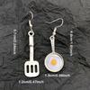 A Pair of Cute Asymmetrical Earrings Shaped Like a Frying Pan And Spatula, Perfect for Daily Wear for a with a Playful Heart