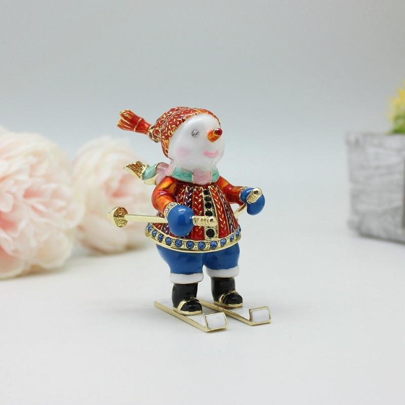Nový vánoční dárek Smaltovaná barva Lyžující sněhulák Kreativní malé ozdoby Úložný box Stolní malé ozdoby