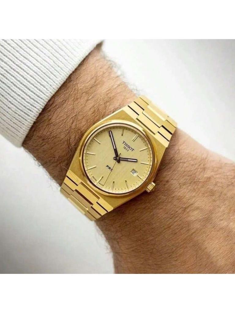 PRX stilvolle elegante Edelstahl-Quarz-Herrenuhr, mit goldenem rundem Zifferblatt Datumsanzeige. Herrenaccessoire geeignet für den täglichen Gebrauch T137.410.33.021.00