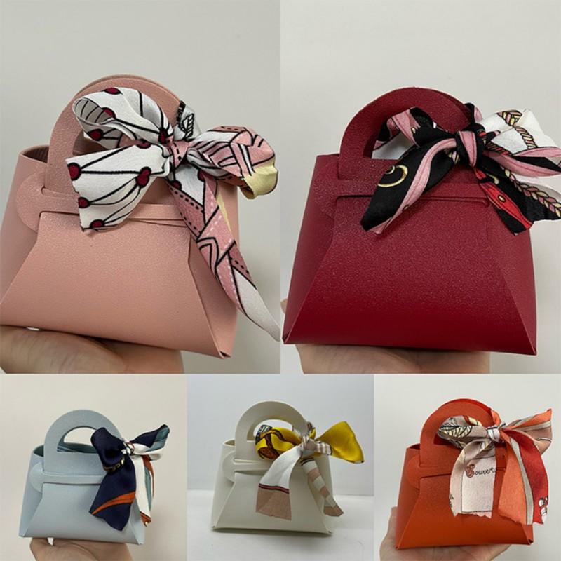 10 pezzi distribuiscono sacchetti regalo in pelle rosa, bomboniere per ospiti, mini borsetta con nastro, scatola per imballaggio di caramelle, decorazioni per feste