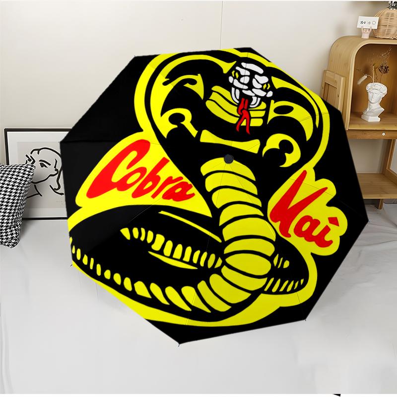 Cobra Kai Fashionable Automatic Opening/Closing Folding Umbrella. Portable and Foldable, Ideal for Gift, Travel, and Daily Use.