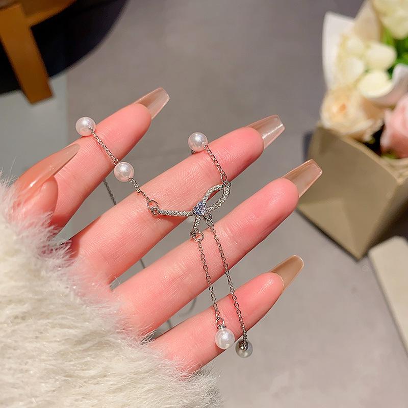 Elegant Bow & Pearl Tassel Titanium Necklace