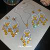 Silver Needle Diamond Inlaid Butterfly Tassel Earrings and Necklace Set: Elegant Hollow Design with Personality and Style.