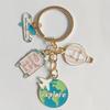 Travel-Themed Keychain: Airplane, Balloon, Map & Suitcase Pendant