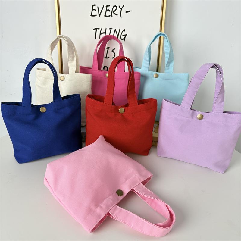 Effenkleurige eenvoudige lunchtas, draagbare canvas tas, kleine stoffen tas, draagbare canvas tas voor het opbergen van diverse spullen