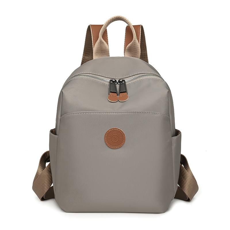 

Жіночий легкий водонепроникний рюкзак великої місткості Студентський шкільний рюкзак для поїздок сірий