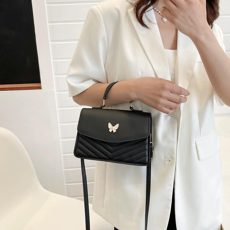 Borsa a tracolla chic nera trapuntata con delicata decorazione a farfalla, elegante borsa con manico superiore, mini alla moda per outfit quotidiani