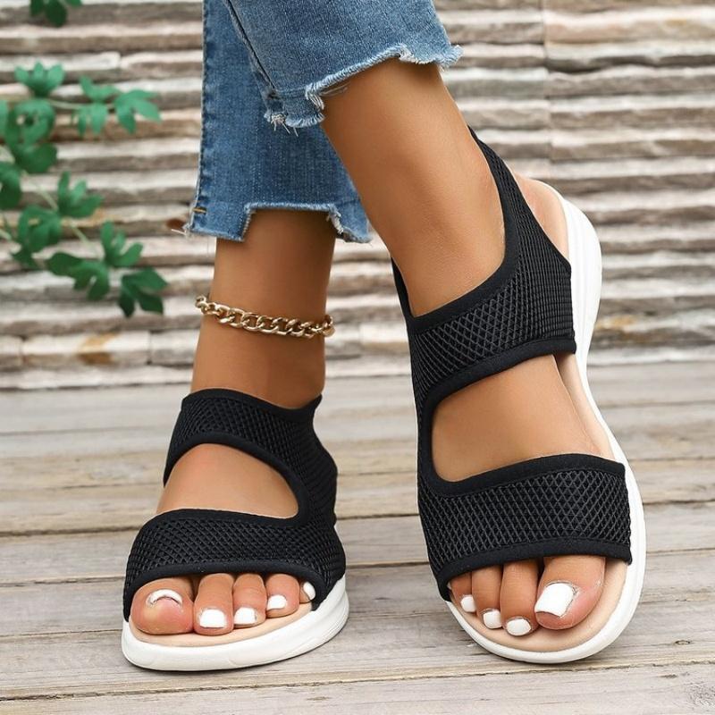 Fashion In the Summer of 2025, the New Fashionable and Lightweight Sports Sandals Feature a Woman Kicking Off a Fish Mouth with One Foot