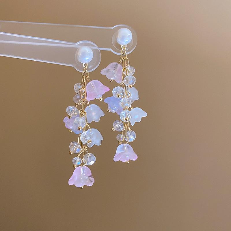 Boucles d'oreilles bohèmes roses à fleurs de perles de rocaille et pompons de perles