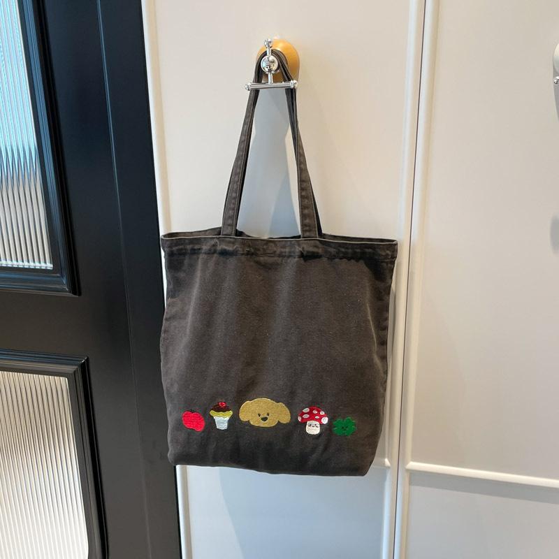 Casual canvas bag design sense niche women's bag 2025 new cartoon printed tote bag large capacity shoulder bag