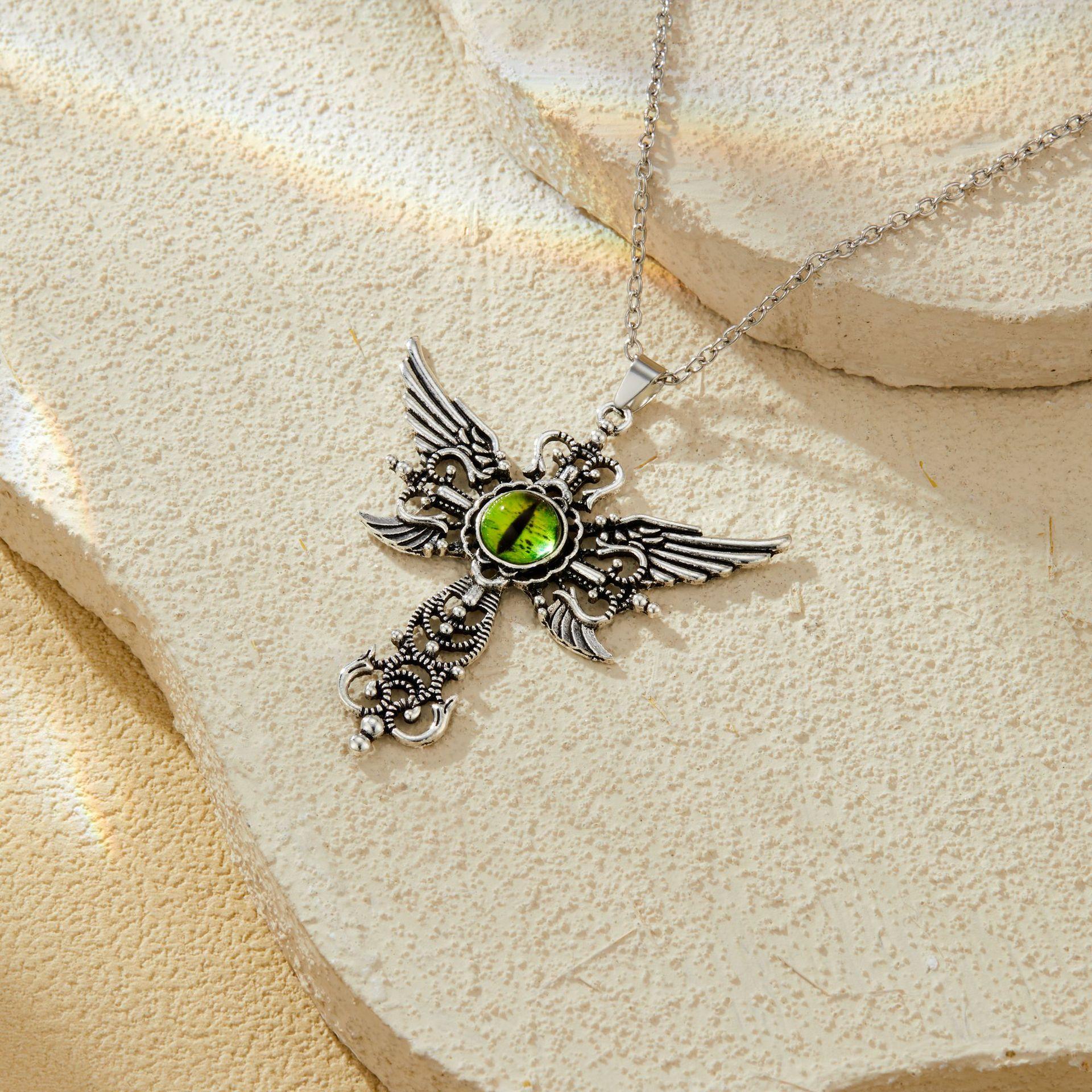 

Evil Blue Elegant Eye Pendant With Alluring Cross And Wing Details For Men And Women Demon Eye Green