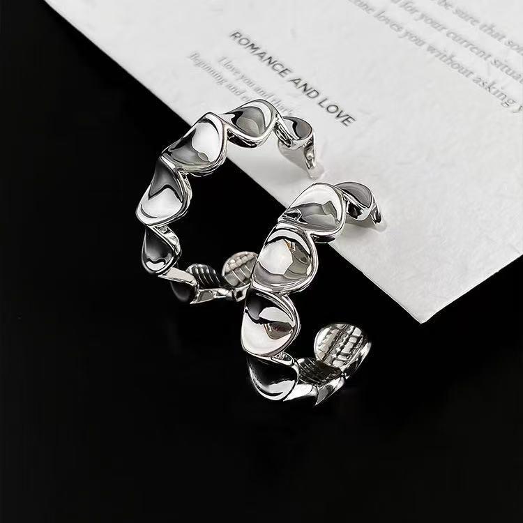 Exquisite Twisted C-Shaped Earrings with Star and Heart Cutouts