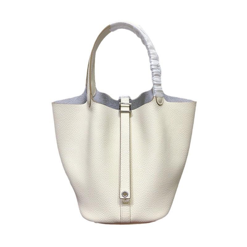 Spot wholesale top layer cowhide vegetable basket bag leather bucket bag commuter fashion lock buckle hand-held handbag woman