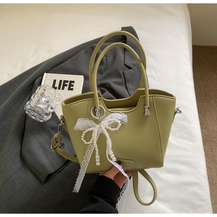 Korean version of the trend hand-carried bucket bag women's summer 2025 new simple fashion versatile shoulder bag niche high sense