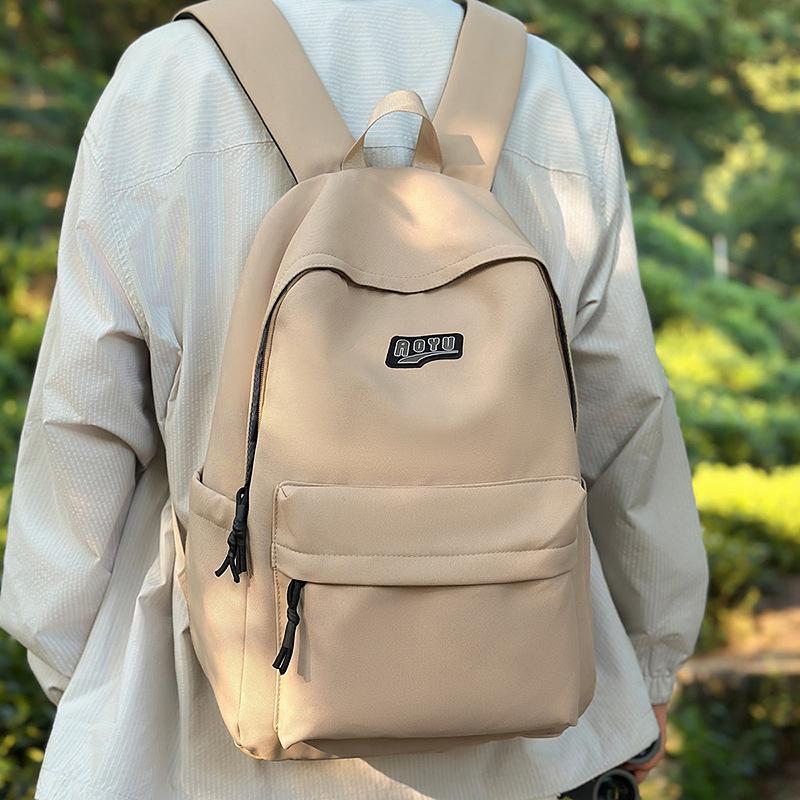 Student schoolbag Junior high school student backpack Elementary school student school large capacity high value solid color schoolbag new