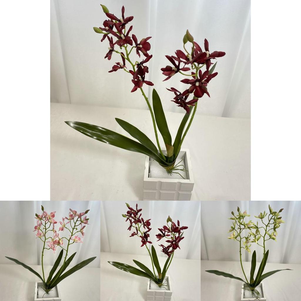 Realistische Seiden-Dendrobium-Orchidee mit Blättern für Blumengesteck auf dem Esstisch