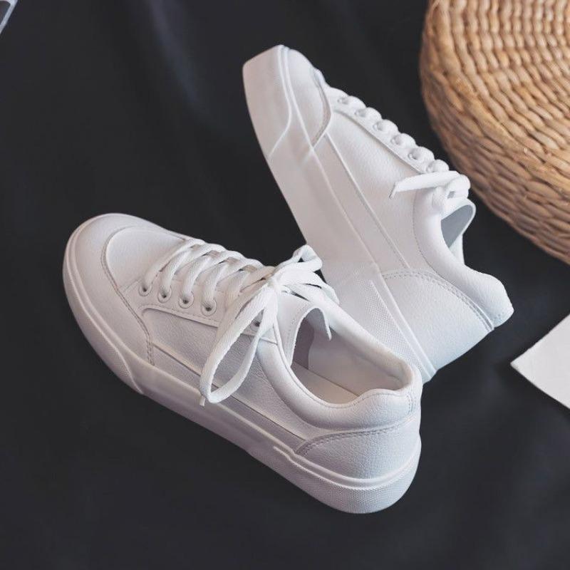 Studenten effen witte schoenen dames eenvoudige dagelijkse leren oppervlak vier seizoenen casual schoenen vetersluiting lage top platte zool dames board schoenen
