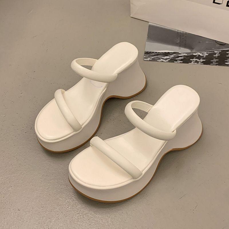 Temperament advanced sense one-word slippers women's summer wear new small thick-bottomed wedge heel high-heeled muffin slippers