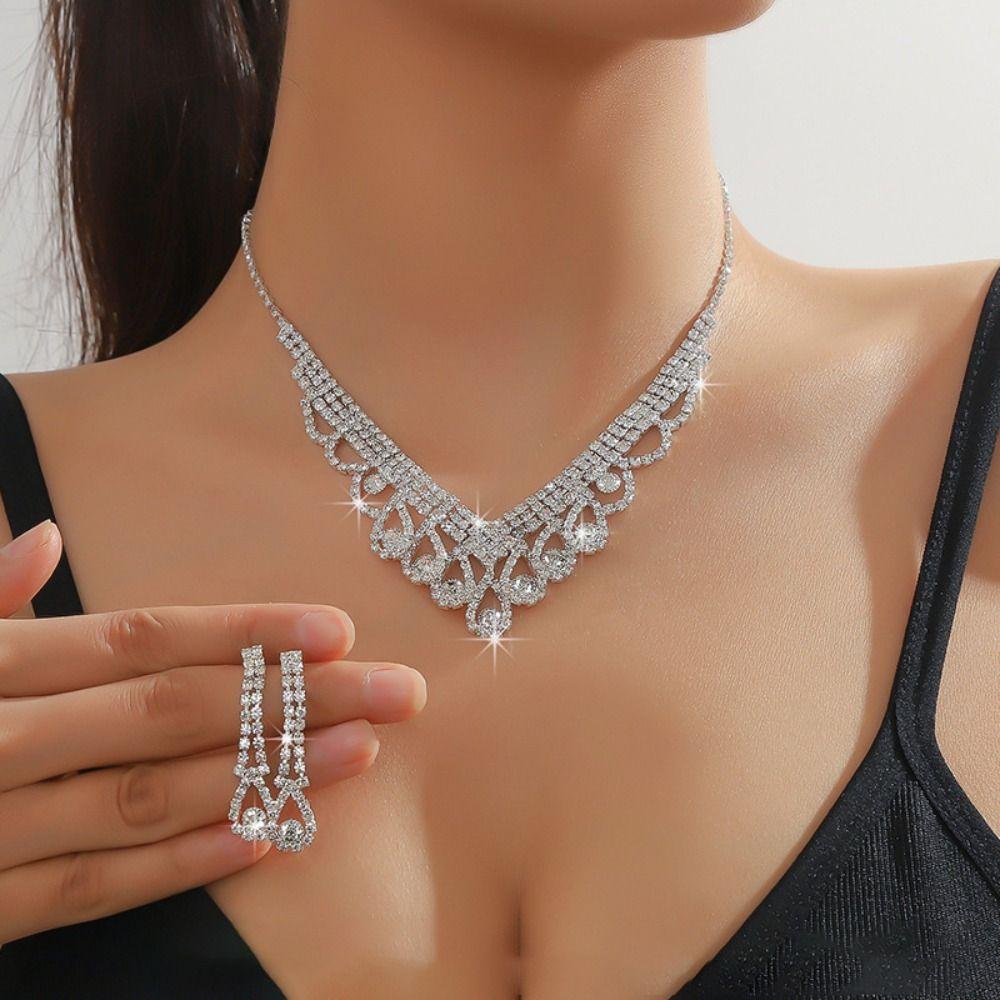 

Модные свадебные комплекты ювелирных изделий Элегантные хрустальные ожерелья Серьги со стразами Подвеска для вечеринки