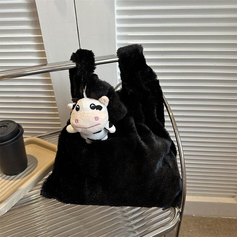 2025 Early Spring New Large Capacity Plush Trend Cow Pattern Personality Student Class Shoulder Bag Female Design Sense