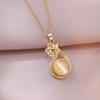 Women's Influencer Necklace: Cat's Eye Stone Rotating Pendant with Clavicle Chain Design