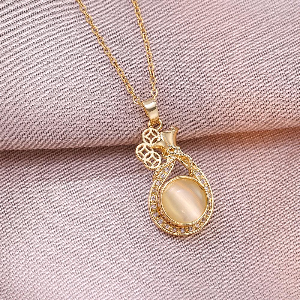Women's Influencer Necklace: Cat's Eye Stone Rotating Pendant with Clavicle Chain Design