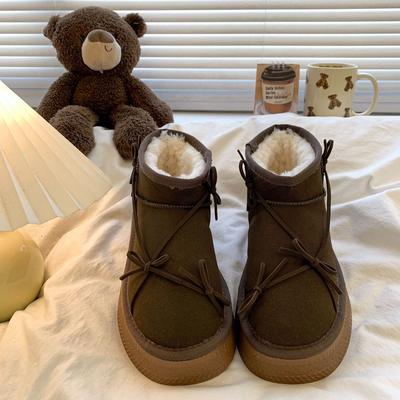 Bottes de neige à semelle épaisse et à nœud pour femmes hiver 2025 nouvelles bottines courtes en velours avec fourrure intégrée chaussures en coton du Nord-Est