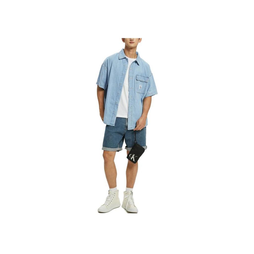 Calvin Klein Camicia da uomo a maniche corte larga con logo ricamato Top Blu Denim J320636-1AA