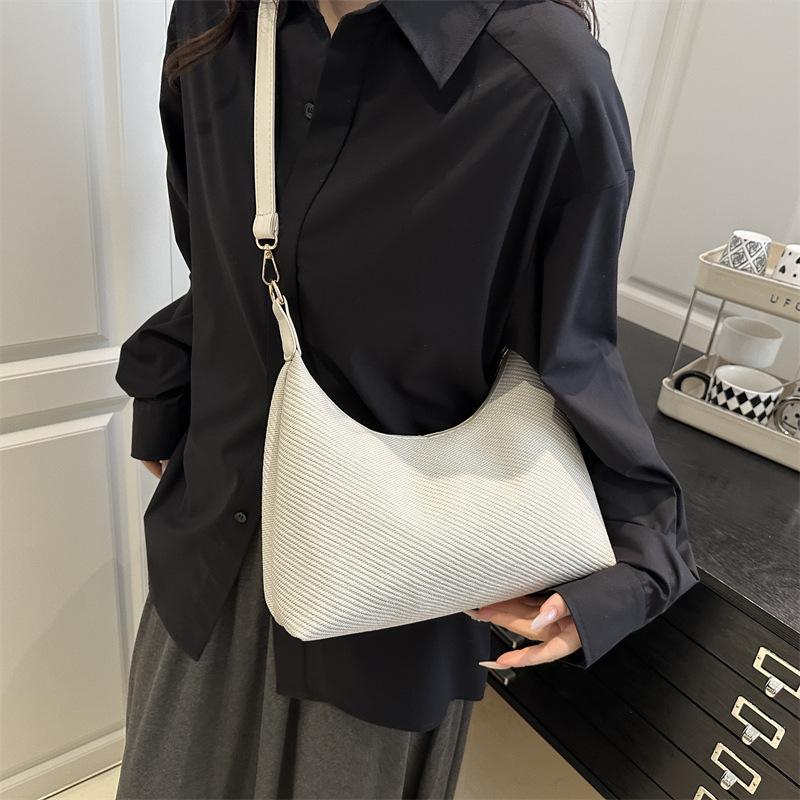 Knitted women's bags niche high-end new popular bags women's messenger bags commuter versatile shoulder armpit bags